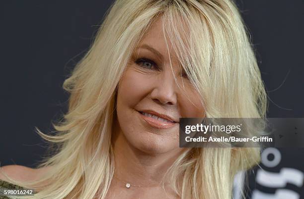 Actress Heather Locklear arrives at the screening of 'Too Close to Home' at The Paley Center for Media on August 16, 2016 in Beverly Hills,...