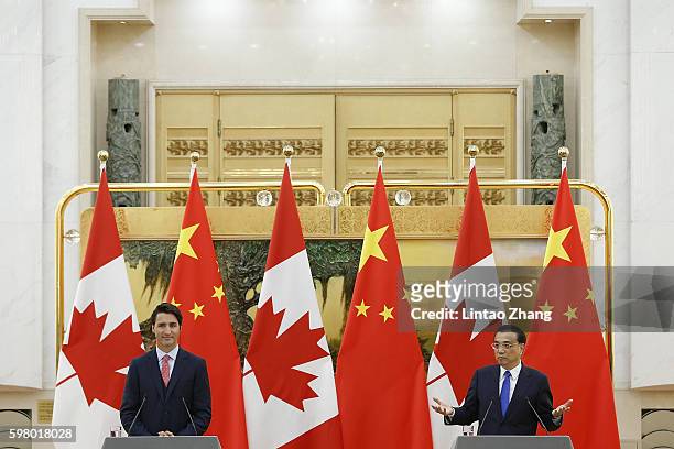 Canadian Prime Minister Justin Trudeau with Chinese Premier Li Keqiang addresses a press conference at the Great Hall of the People on August 31,...