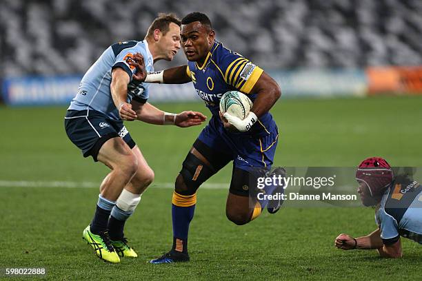 Naulia Dawai of Otago fends off Peter Breen of Northland during the round three Mitre 10 Cup match between Otago and Northland at Forsyth Barr...