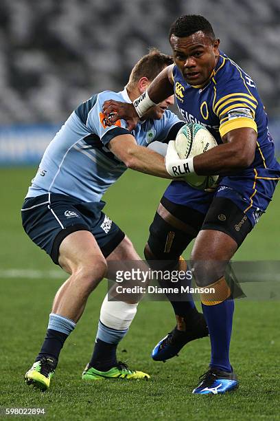 Naulia Dawai of Otago fends off Peter Breen of Northland during the round three Mitre 10 Cup match between Otago and Northland at Forsyth Barr...