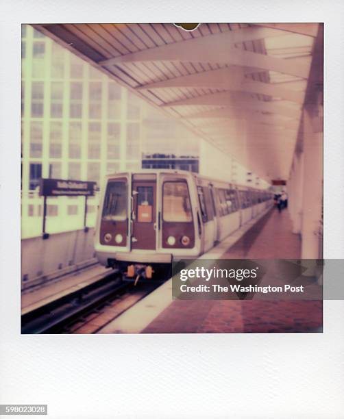 Train pulls into the NoMa station on August 10, 2013 in Washington, DC. The image was taken with a Polaroid SX-70 camera using the Impossible Project...