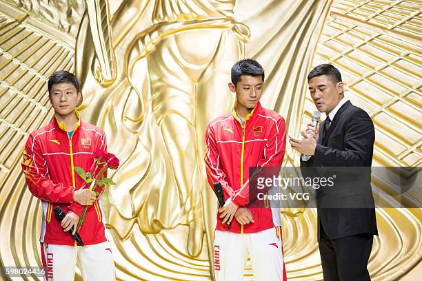 Chinese table tennis players Ma Long and Zhang Jike and host Wu Dawei attend a party at East Asian Games Dome during their visit to Macau after Rio...