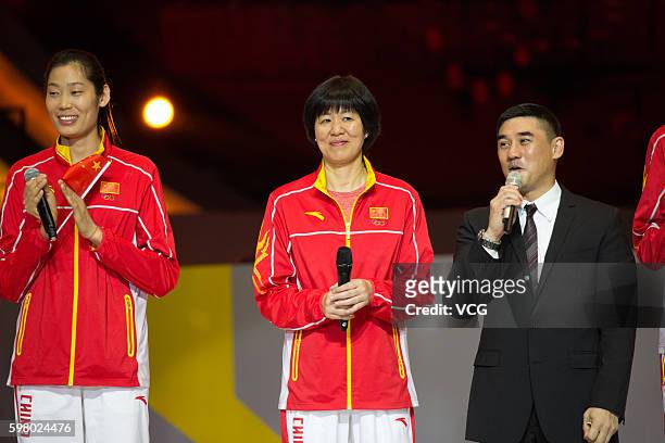 Chinese volleyball star Zhu Ting and volleyball head coach Lang Ping and host Wu Dawei attend a party at East Asian Games Dome during their visit to...