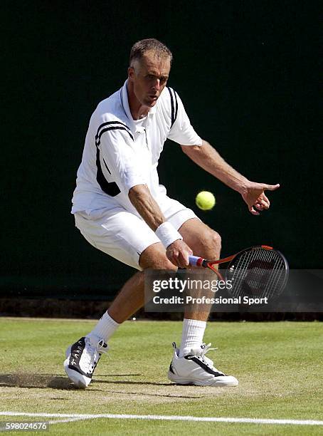 Todd Martin of USA in action during his match against Sjeng Schalken of the Netherlands at the Wimbledon Lawn Tennis Championship on June 25, 2004 at...