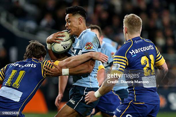Solomon Alaimalo of Northland in the tackle of Jack Wilson and Kaide Whiting of Otago during the round three Mitre 10 Cup match between Otago and...