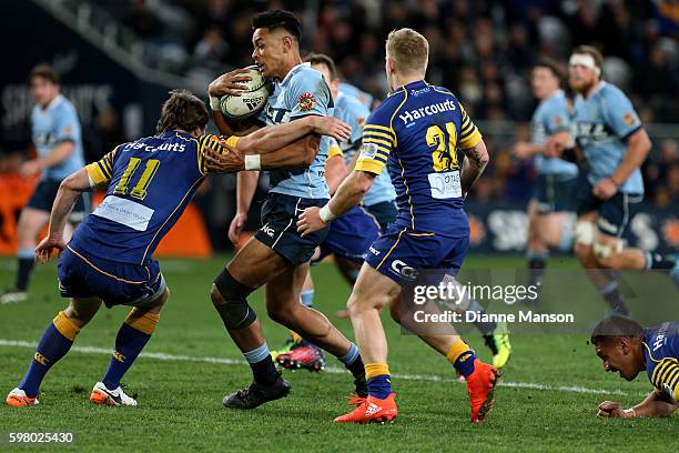 Solomon Alaimalo of Northland in the tackle of Jack Wilson and Kaide Whiting of Otago during the round three Mitre 10 Cup match between Otago and...