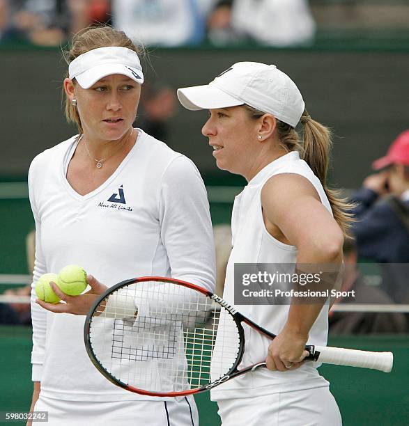 Lisa Raymond of the USA in discussion with teammate Samantha Stosur of Australia during the Ladies Doubles Semi Final against Katarina Srebotnik of...