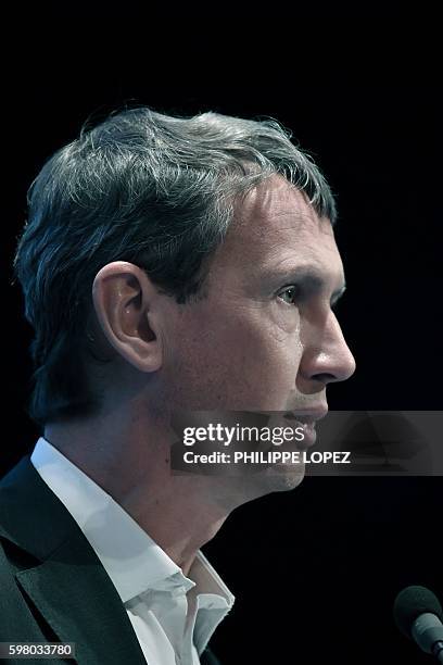 Maxime Lombardini, the general director of French provider of telecommunication services Iliad, addresses a press conference in Paris on August 31,...