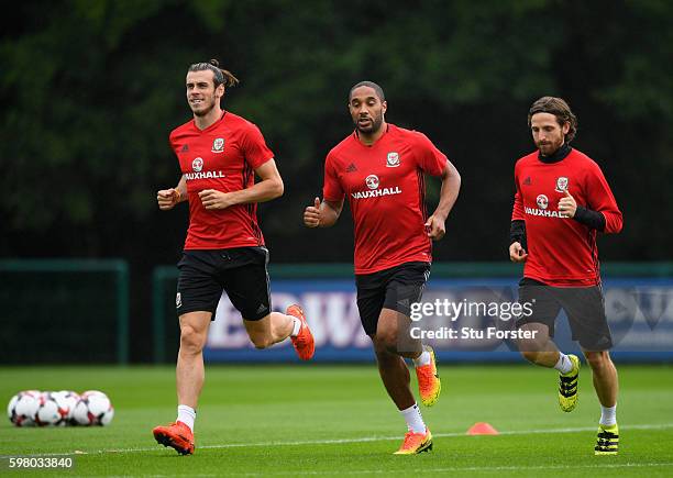 Wales players Gareth Bale Ashley Williams and Joe Allen in action during Wales training ahead of their FIFA World Cup qualifier against Moldova at...