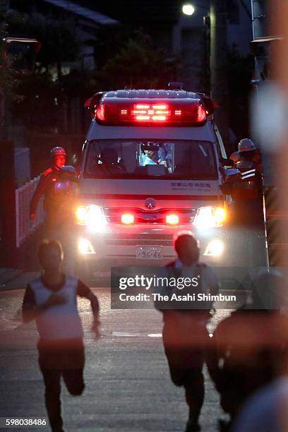 An Amburance carrying Yasuhide Mizobata who waged a nearly 18-hear standoff with police, is taken to hospital after shooting himself in the abdomen...