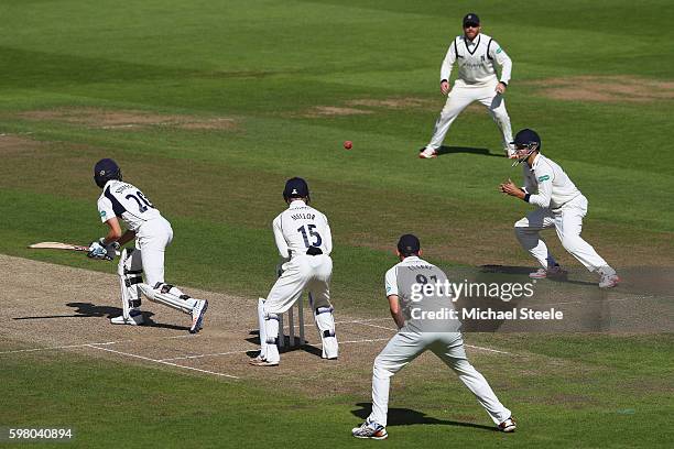 John Simpson of Middlesex is caught by Sam Hain of Warwickshire off the bowling of Josh Poysden during day one of the Specsavers County Championship...