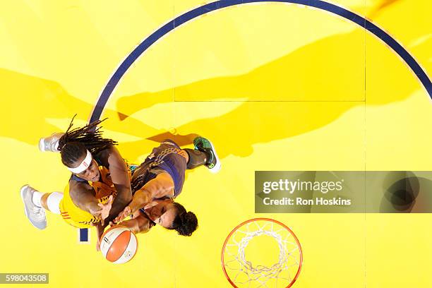 Lynetta Kizer of the Indiana Fever drives to the basket against Mistie Bass of the Phoenix Mercury on August 30, 2016 at Bankers Life Fieldhouse in...