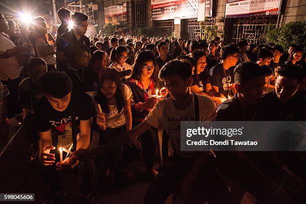 College students light candles in a candle lighting against extrajudicial killings on August 31, 2016 in Manila, Philippines. President Rodrigo...