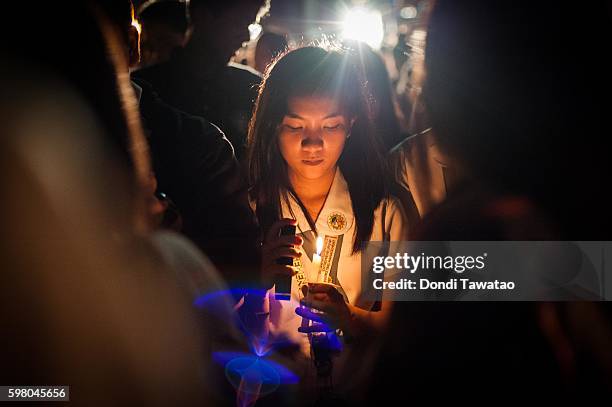 College students light candles in a candle lighting vigil against extrajudicial killings on August 31, 2016 in Manila, Philippines. President Rodrigo...