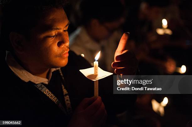 College students light candles in a candle lighting vigil against extrajudicial killings on August 31, 2016 in Manila, Philippines. President Rodrigo...