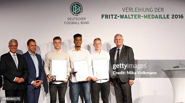 Benjamin Henrichs of Bayer 04 Leverkusen, Philipp Ochs of TSG 1899 Hoffenheim and Maximilian Mittelstaedt of Hertha BSC Berlin are awarded by DFB...