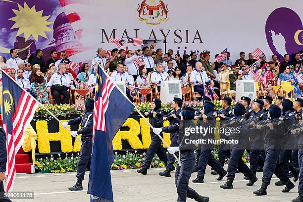 Malaysia's Prime Minister Najib Razak and his deputy Ahmad Zahid Hamidi wave national flags during the 59th National Day celebrations at Independence...