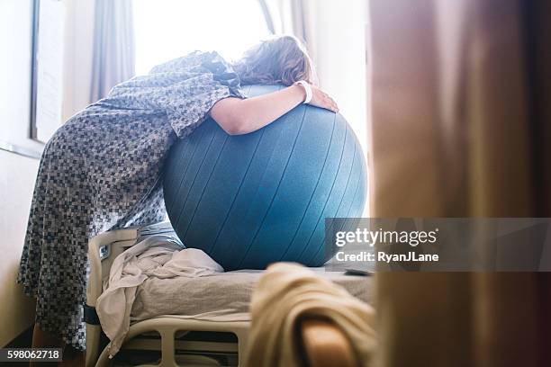 pregnant woman in hospital bed - yoga ball stock pictures, royalty-free photos & images