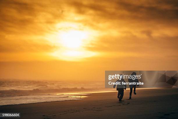 kids running towards the sun - fog camper stock pictures, royalty-free photos & images