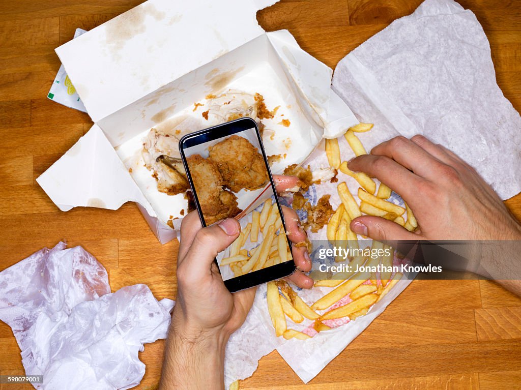 Picture of meal on mobile phone, greasy hands