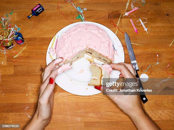 female eating cake - birthday cake overhead stock pictures, royalty-free photos & images