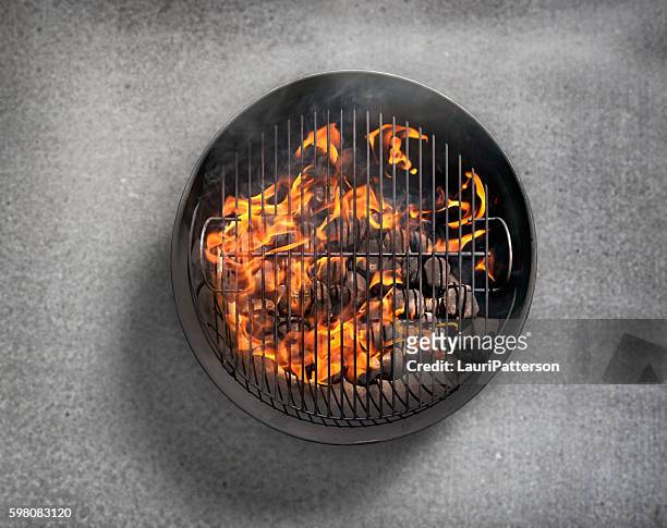 charcoal bbq on a concrete patio - high angle view stock pictures, royalty-free photos & images