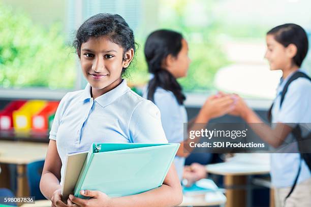 smiling middle school student in classroom - charter school stock pictures, royalty-free photos & images