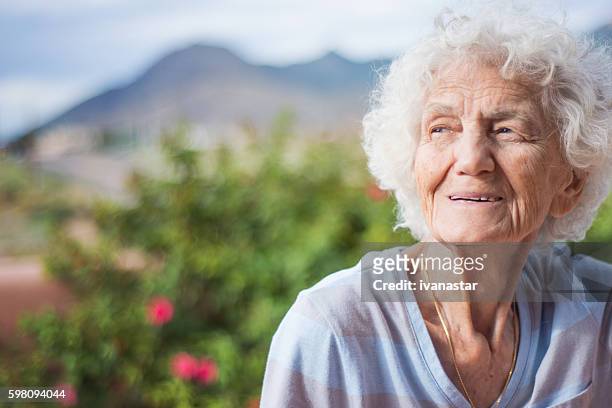 senior woman outdoors, pensive - 85 2016 stock pictures, royalty-free photos & images