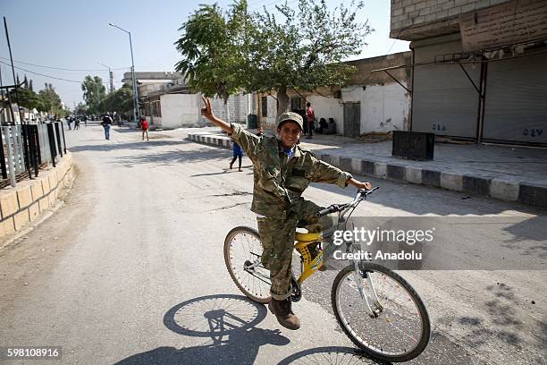 Syrian people are seen in Jarabulus District of Aleppo, Syria after the district's centrum freed from Daesh terrorists during the "Operation...