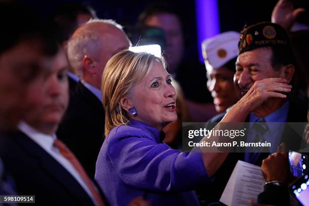 Democratic presidential nominee Hillary Clinton greets attendees at the American Legion Convention August 31, 2016 in Cincinnati, Ohio. Clinton spoke...