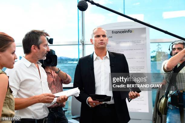 Franceinfo's French journalist Louis Laforge takes part in a rehearsal, on August 31 2016, at the headquarters of France Televisions, the French...