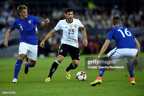 Kevin Volland of Germany vies with Robin Lod and Thomas Lam of Finland during the international friendly match between Germany and Finland at...