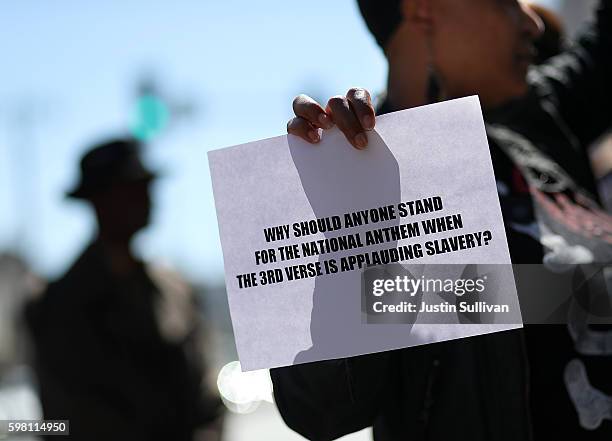 Protestor holds a sign during a demonstration in support of San Francisco 49ers quarterback Colin Kaepernick outside of the San Francisco Police...