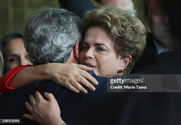 Impeached President Dilma Rousseff hugs a supporter after delivering her farewell speech at Alvarado Palace after she was impeached by the Senate on...