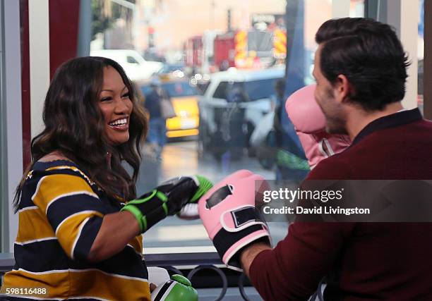 Actress/host Garcelle Beauvais spars with actor Edgar Ramirez at Hollywood Today Live at W Hollywood on August 31, 2016 in Hollywood, California.