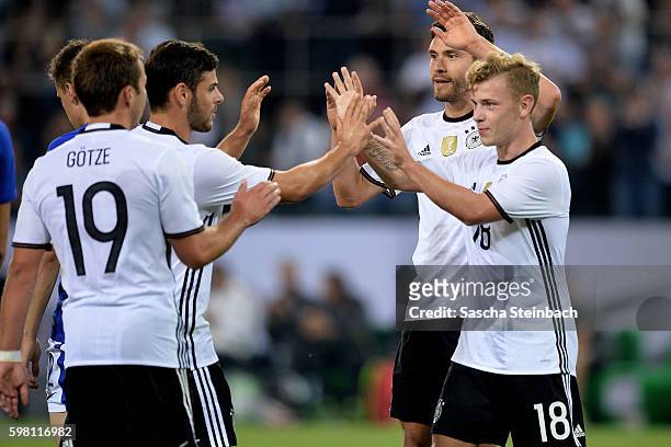 Max Meyer of Germany celebrates with team mates after scoring the opening goal during the international friendly match between Germany and Finland at...