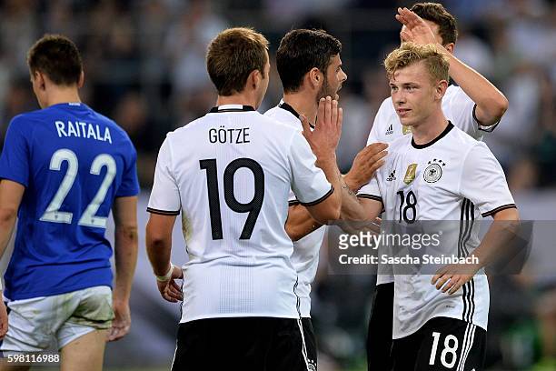 Max Meyer of Germany celebrates with team mates after scoring the opening goal during the international friendly match between Germany and Finland at...