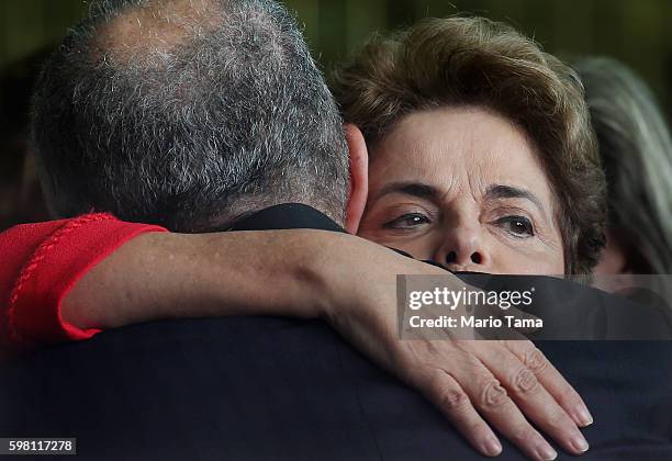 Impeached President Dilma Rousseff hugs a supporter after delivering her farewell speech at Alvarado Palace after she was impeached by the Senate on...