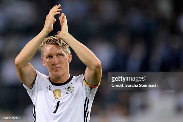 Bastian Schweinsteiger of Germany reacts after the international friendly match between Germany and Finland at Borussia-Park on August 31, 2016 in...