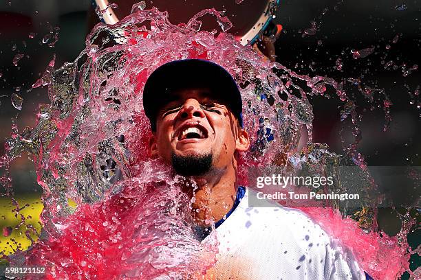 Carlos Gomez of the Texas Rangers is soaked with a Powerade cooler after the Texas Rangers beat the Seattle Mariners 14-1 at Globe Life Park in...