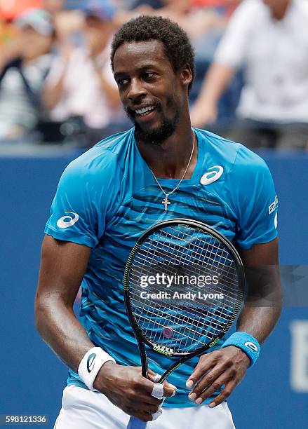 Gael Monfils of France celebrates his victory over Jan Satral of the Czech Republic during his second round Men's Singles match on Day Three of the...