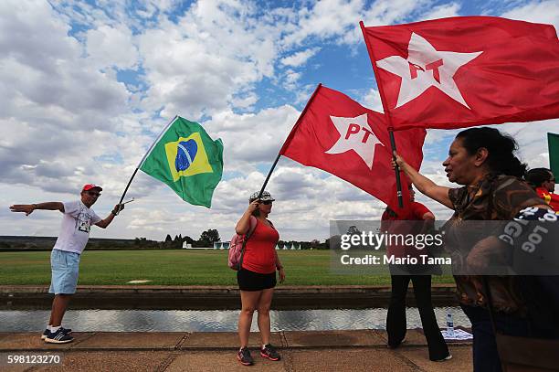 Supporters of impeached President Dilma Rousseff gather outside Alvorado Palace on August 31, 2016 in Brasilia, Brazil. Rousseff was impeached by the...