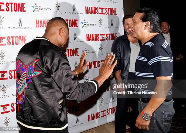 Usher Raymond and Roberto Duran attend the screening of 'Hands of Stone' at Pacific Theatres at The Grove on August 15, 2016 in Los Angeles,...