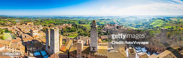 italy san gimignano medieval towers terracotta rooftops iconic town tuscany - san gimignano stock pictures, royalty-free photos & images
