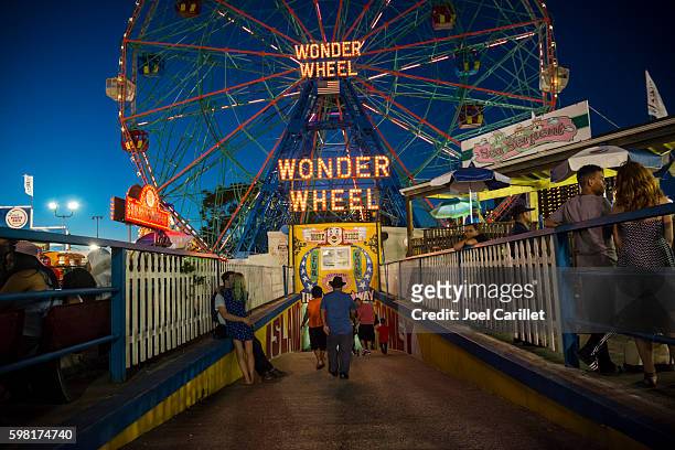 summer evening at luna park on coney island - luna park coney island stock pictures, royalty-free photos & images