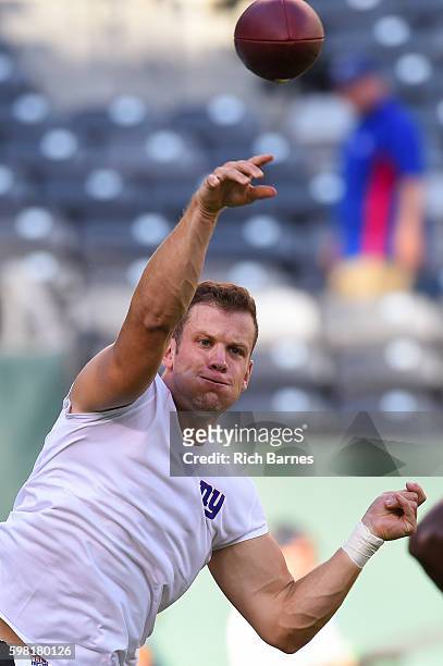 Ryan Nassib of the New York Giants warms up prior to a preseason game against the New York Jets at MetLife Stadium on August 27, 2016 in East...