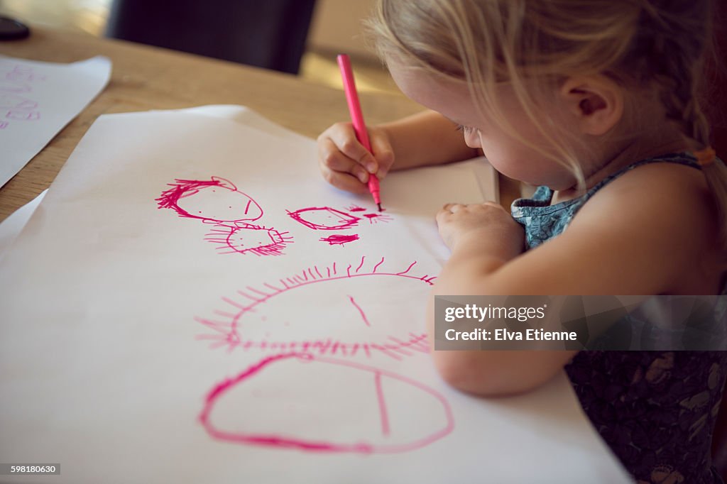 Preschool age child drawing a picture