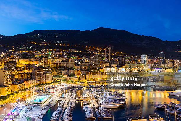 monaco harbour at twilight. - thailändische geldmünze stock-fotos und bilder