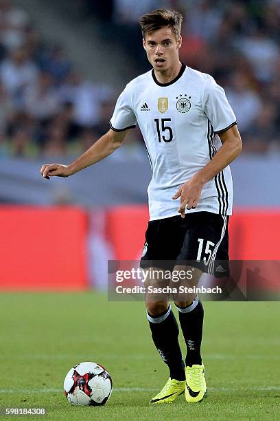 Julian Weigl of Germany runs with the ball during the international friendly match between Germany and Finland at Borussia-Park on August 31, 2016 in...