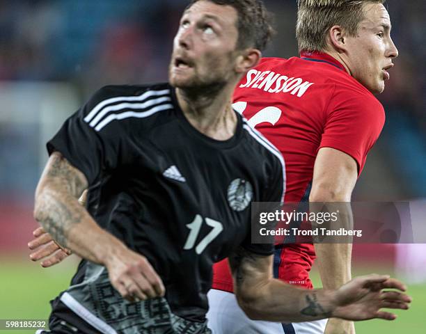 Jonas Svensson of Norway , Mikhail Sivakou of Belarus during the match between Norway and Belarus at Ullevaal Stadion on August 31, 2016 in Oslo,...